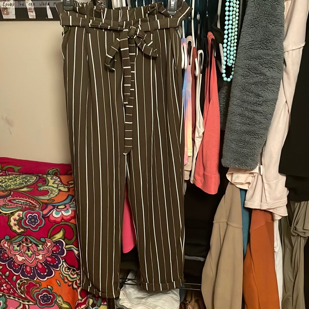 Dark green and white striped pants with ruffle waist.